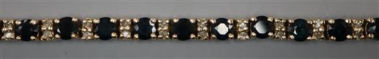 A 9k and sapphire set line bracelet, 18.5cm.